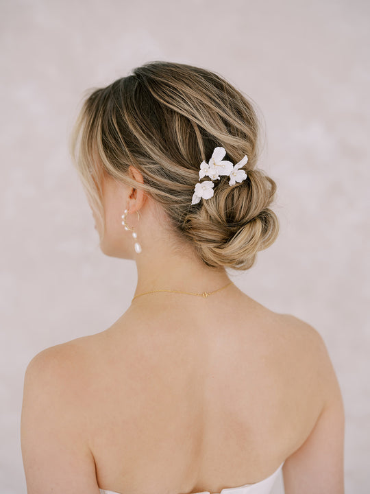 New York Bride wearing flower bridal hairpins by Joanna Bisley Designs.