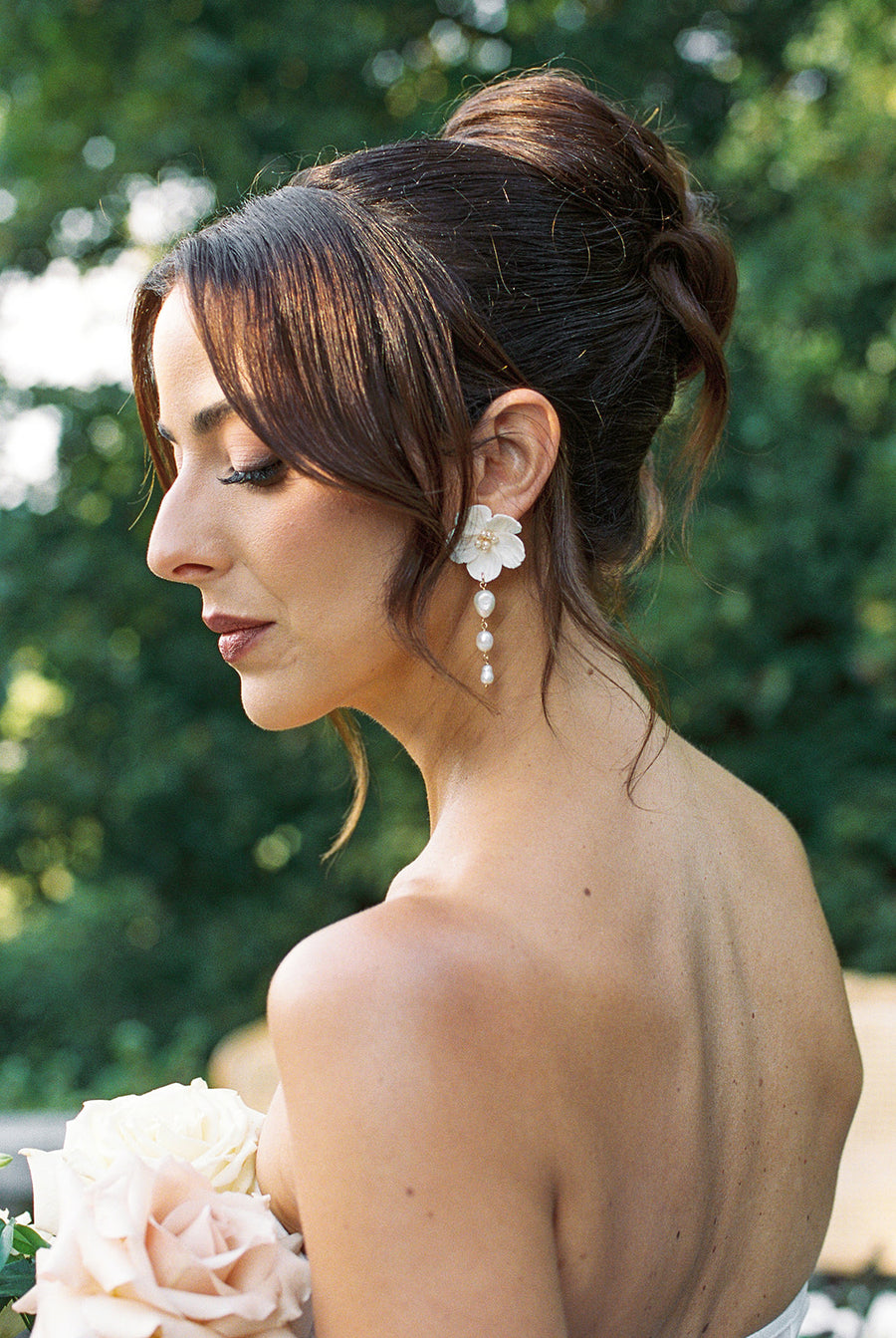 A bride from Vancouver wearing statement unique floral and baroque pearl earrings by Joanna Bisley Designs. 