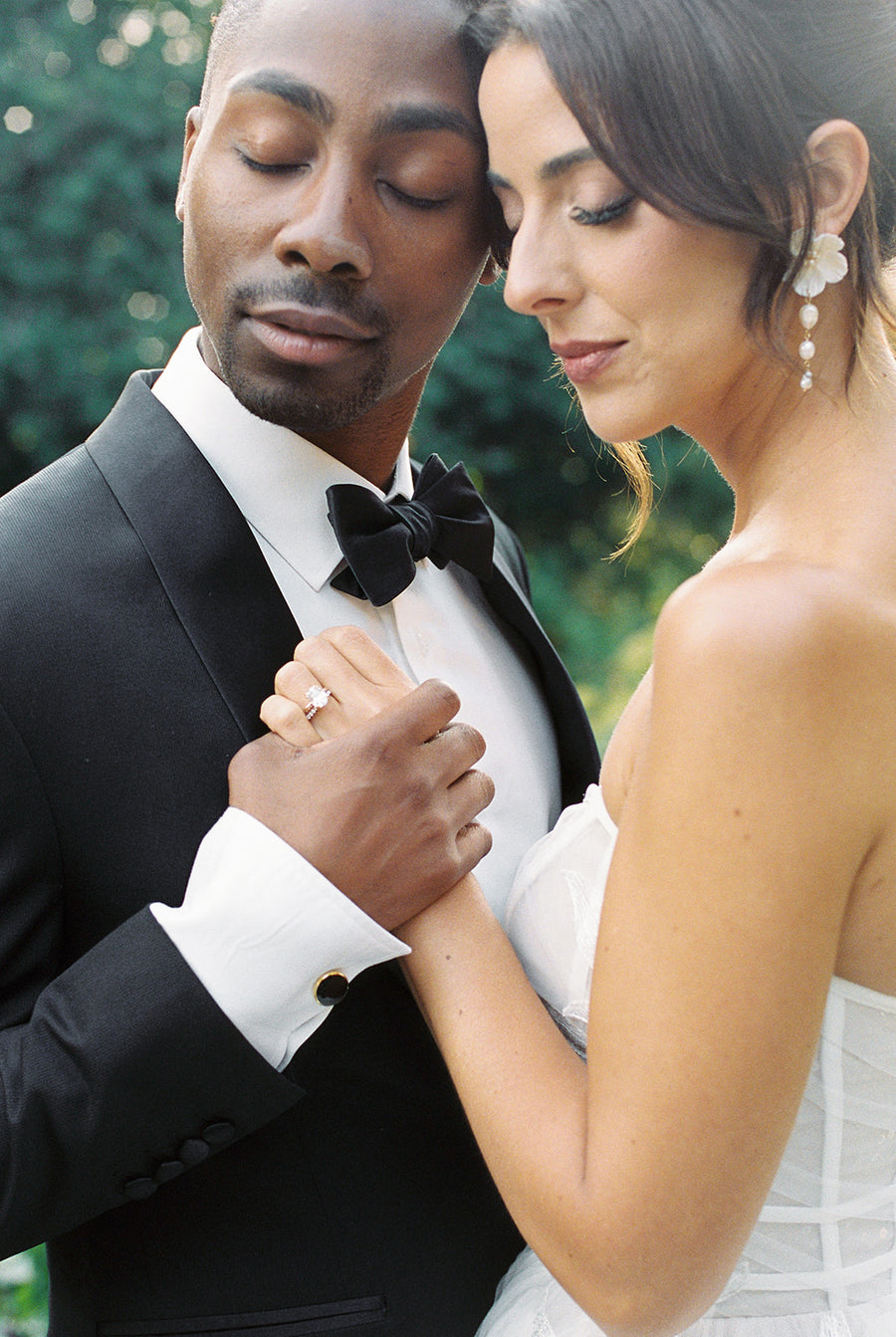 A Vancouver Bride wearing strapless dress wearing statement luxury bridal earrings by Joanna Bisley Designs . 