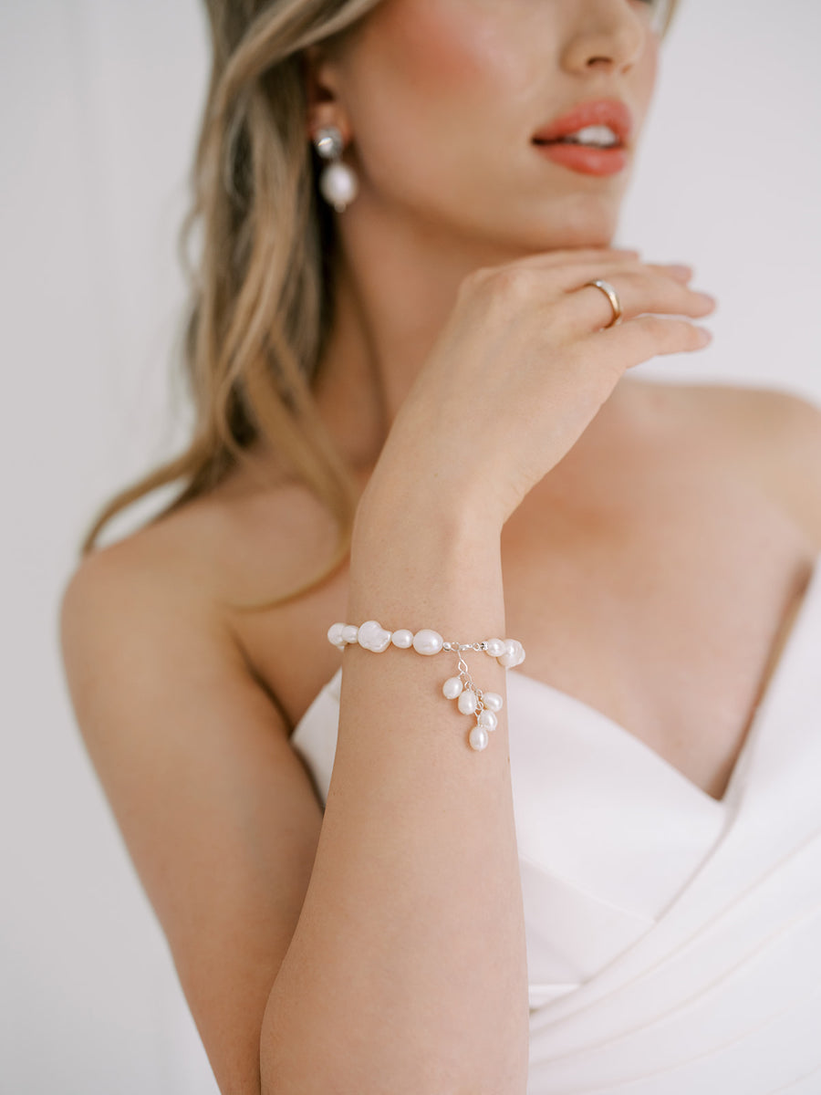 Baroque Pearl and Freshwater Pearl bridal bracelet on brides wrist.