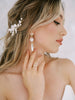 Bride wearing Swarovski Crystal earrings handcrafted by Joanna Bisley Designs in Calgary Canada.