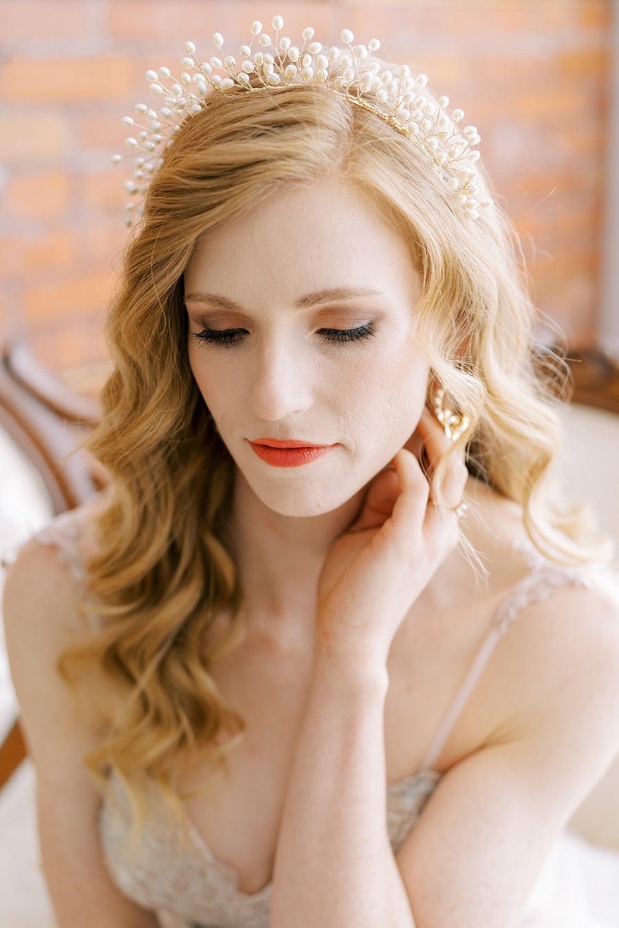 Bride wearing luxury pearl headband by Joanna Bisley Designs.