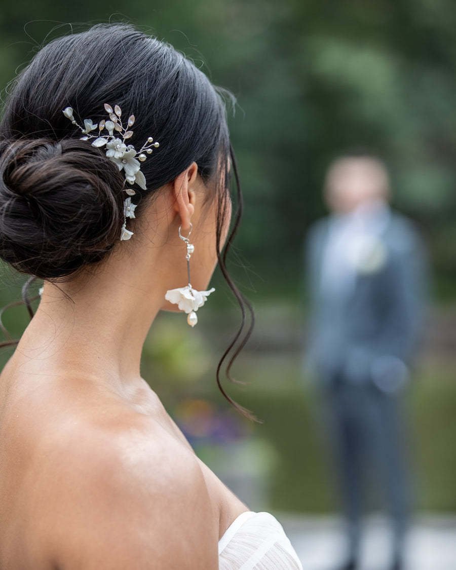 Close up of a bride's wedding hair updo with romantic bridal comb.