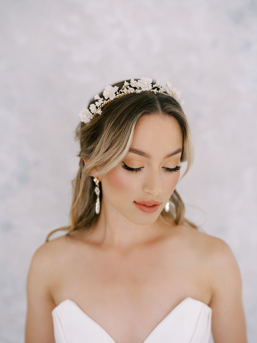 Bride wearing flower bridal crown with a bit of sparkle.