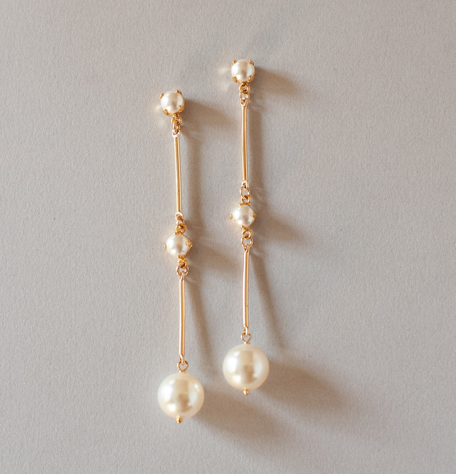 Modern long pearl bridal earrings with pearl drop by Joanna Bisley Designs.