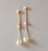 Modern long pearl bridal earrings with pearl drop by Joanna Bisley Designs.