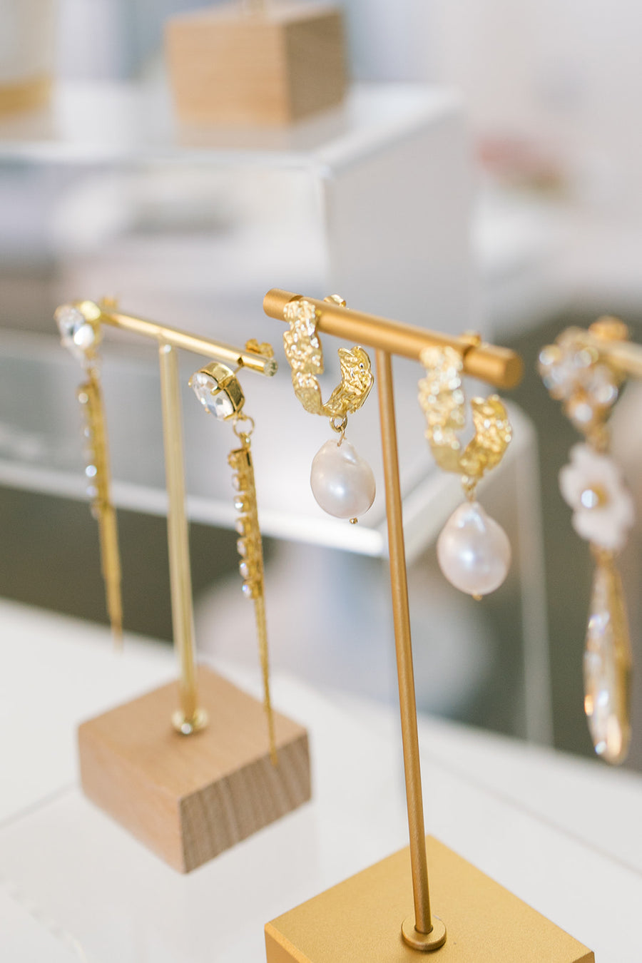 Pearl and crystal bridal earring by Joanna Bisley Designs' on earring stands.