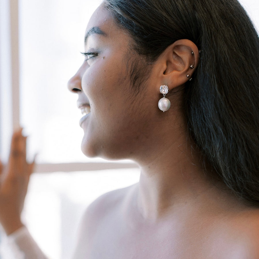 New York Bride wearing a luxury pair of bridal earrings by Joanna Bisley Designs.