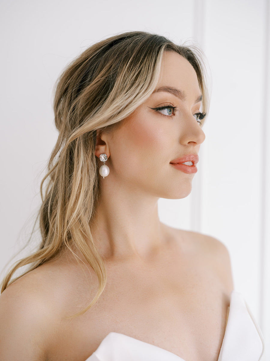 Bridal wearing baroque pearl earrings on Swarovski Crystal stud