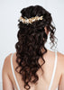 A bride with half up half down bridal hairstyle wearing a statement Wedding comb by Joanna Bisley Designs.