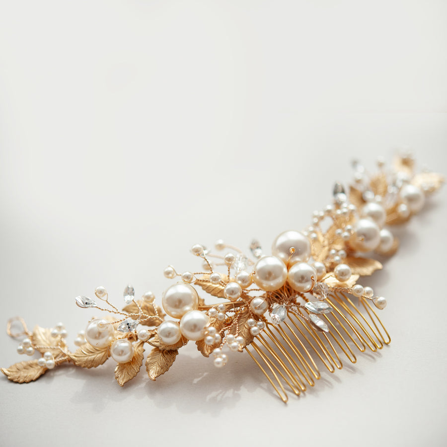 A statement bridal headpiece handcrafted in Calgary with pearls, Swarovski Crystal and leaf detailing.