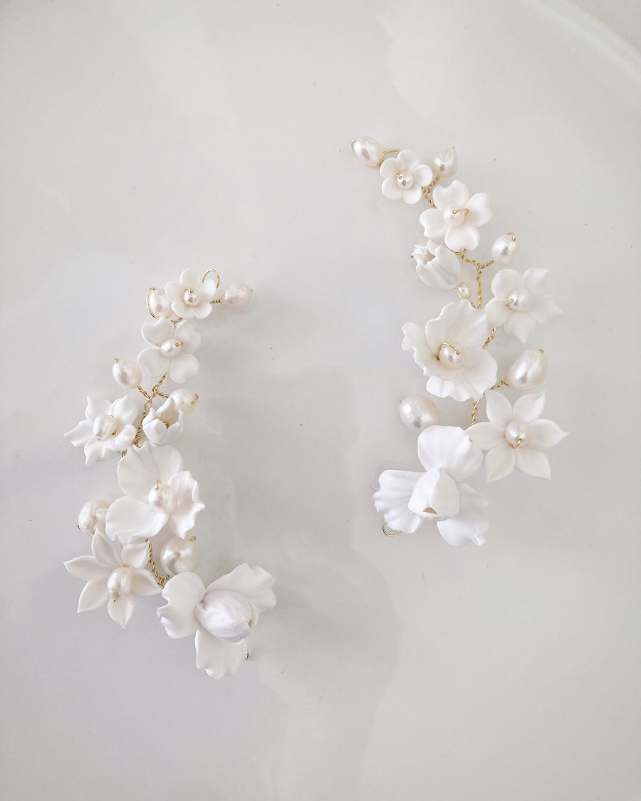 Luxury Bridal Headpieces handmade with baroque pearls and clay florals.