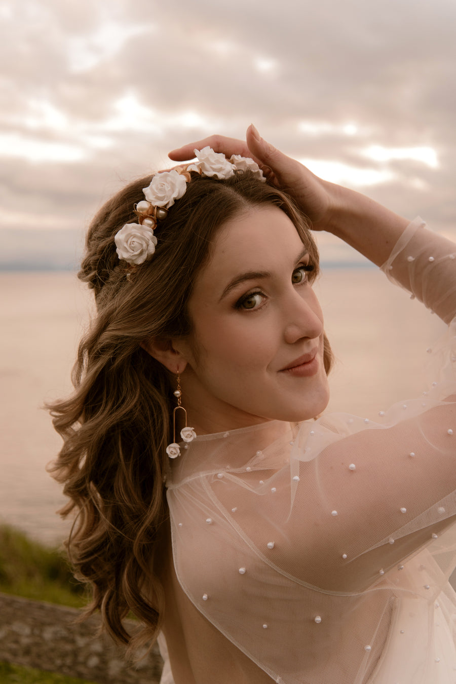 Bride with hair half up half down wearing a rose bridal headband by Canadian designer Joanna Bisley Designs.