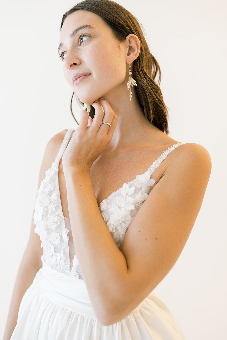 New York Bride wearing hair down adorned with long statement pearl earrings by Joanna Bisley Designs.