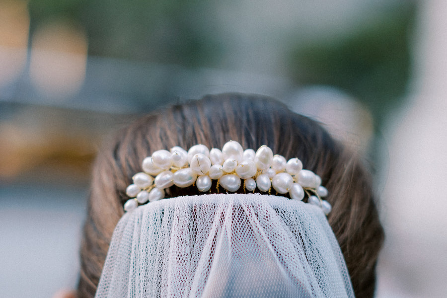 Montreal bride wearing beautiful freshwater wedding comb above her veil.