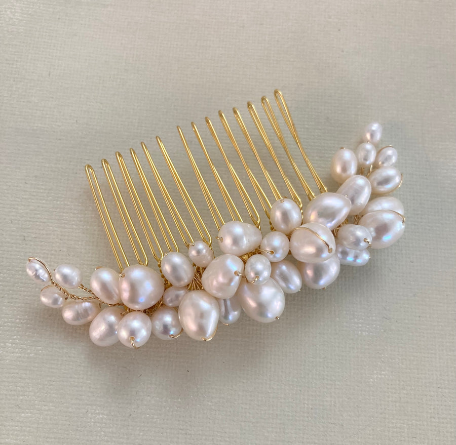 An exquisite bridal comb handmade with a selection of high quality pearls.