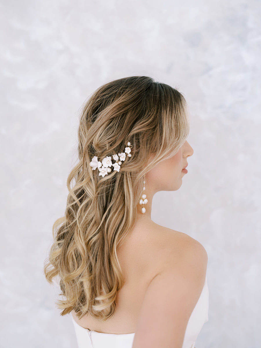 Bride wearing pearl Chandelier Earrings with Flower Bridal Hairpiece