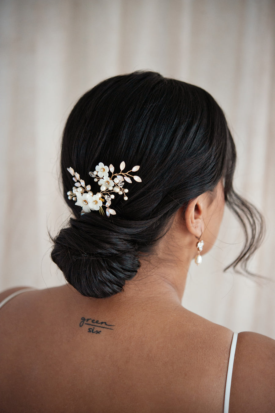 Bride wearing luxury bridal hairpins by Joanna Bisley Designs.