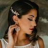 Bride wearing an elegant crystal and leaf bridal comb in gold, handcrafted by Joanna Bisley Designs.